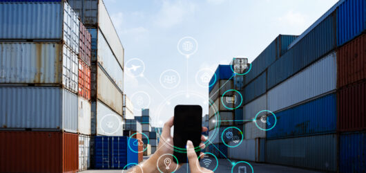 Businessman hand holding smartphone with AR application for check order in smart factory warehouse, technology interface global partner connection for Logistic Import Export background